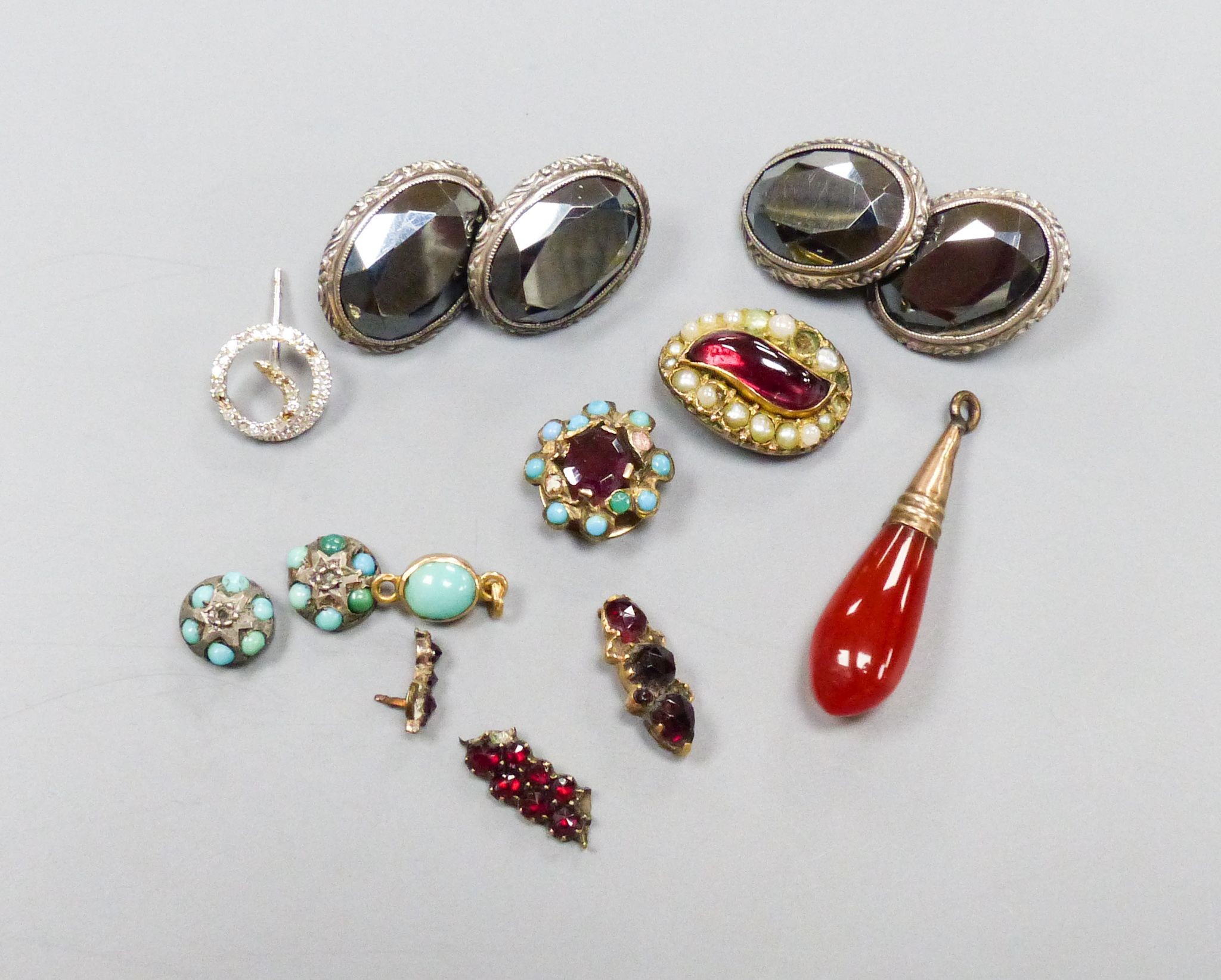 Mixed jewellery including a pair of white metal and hematite cufflinks, diamond set pin head, garnet set mounts etc.